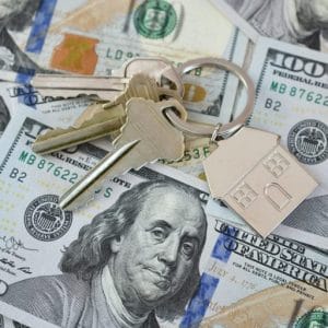 We Buy Houses 3 Housing Market Concept - House Keys On Money Currency, Real Estate, Home For Sale, Equity Buy Sell